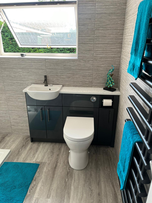 Anthracite gloss vanity and WC unit with teal towels